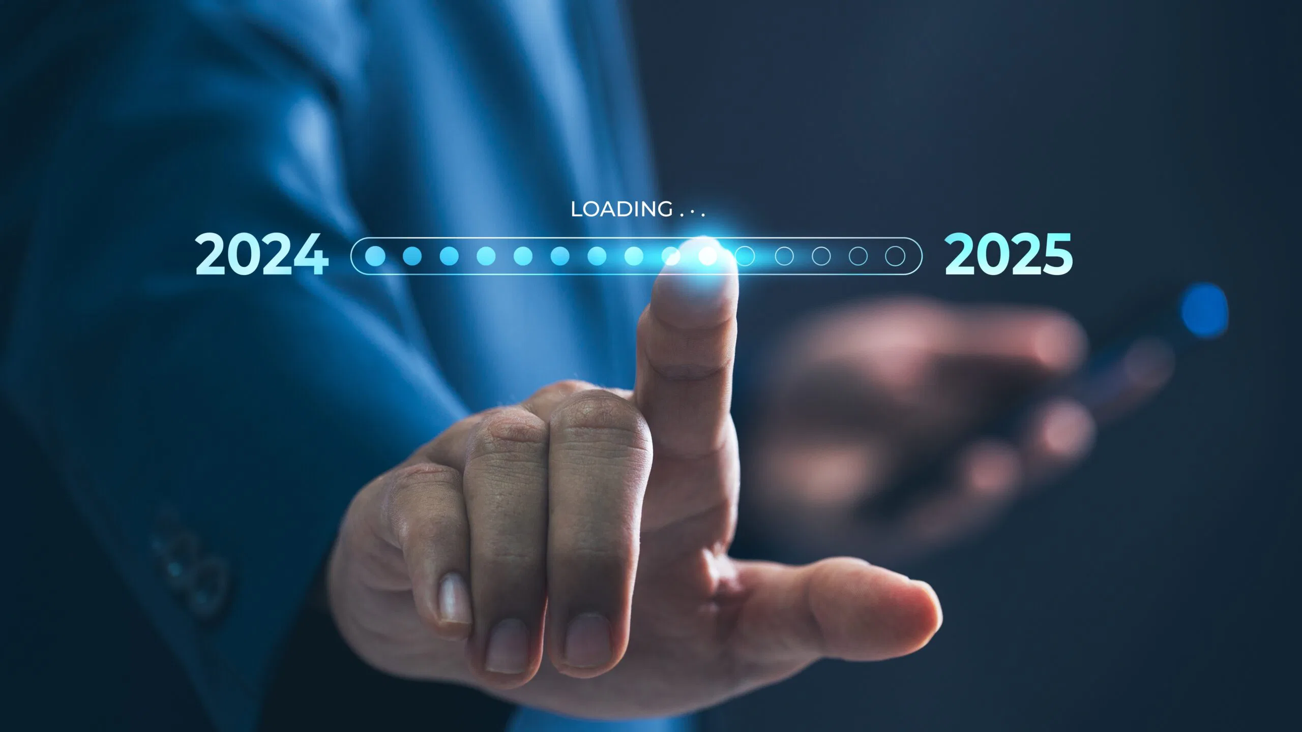 A businessman touches a digital progress bar indicating the transition from 2024 to 2025, symbolizing strategic planning, future readiness and challenge strategy for an HVAC Company